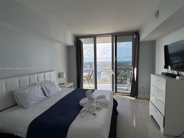 2600 E Hallandale Beach Blvd Unit T3210, Hallandale Beach, FL 33009 - bedroom featuring floor to ceiling windows, light tile patterned flooring, baseboards, and access to outside