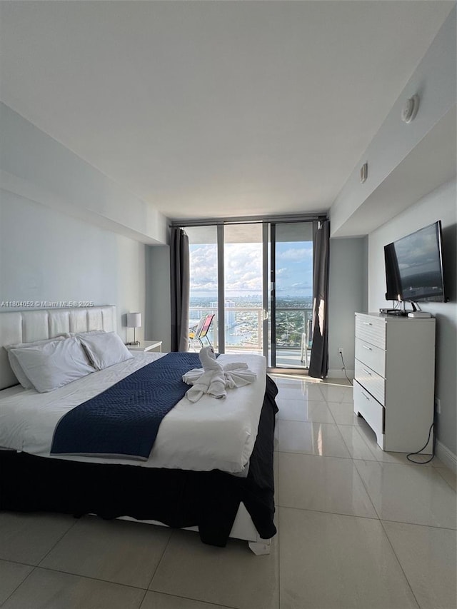 2600 E Hallandale Beach Blvd Unit T3210, Hallandale Beach, FL 33009 - bedroom with baseboards and a wall of windows