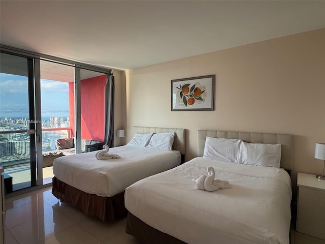 2600 E Hallandale Beach Blvd Unit T3210, Hallandale Beach, FL 33009 - bedroom featuring floor to ceiling windows, access to exterior, and light tile patterned floors