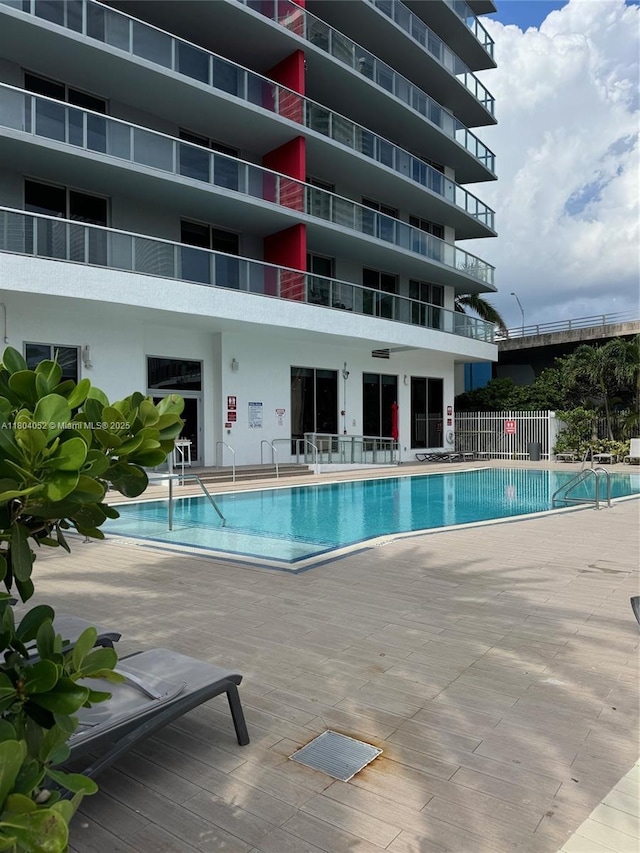 2600 E Hallandale Beach Blvd Unit T3210, Hallandale Beach, FL 33009 - community pool featuring a patio area and fence