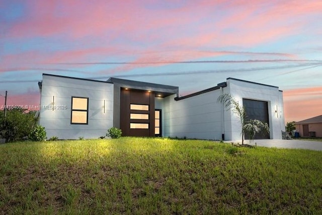 4623 7th St W, Lehigh Acres, FL 33971 - contemporary home featuring an attached garage and a front yard