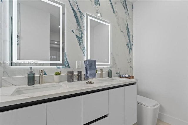 4623 7th St W, Lehigh Acres, FL 33971 - bathroom with double vanity, baseboards, and toilet