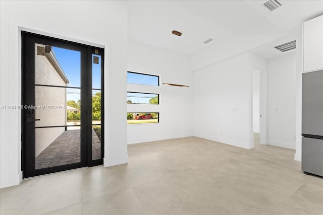 4623 7th St W, Lehigh Acres, FL 33971 - unfurnished room featuring light tile patterned flooring and baseboards