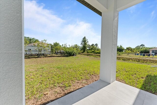 4623 7th St W, Lehigh Acres, FL 33971 - view of grassy yard with a patio area