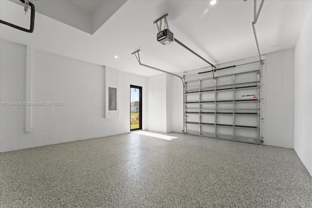4623 7th St W, Lehigh Acres, FL 33971 - garage featuring a garage door opener and electric panel