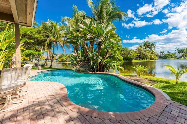 outdoor pool with a water view