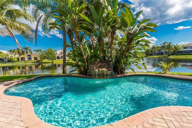 outdoor pool with a water view and a residential view