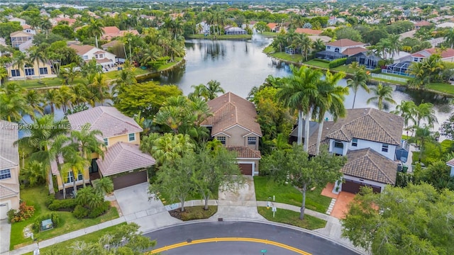 aerial view of residential area featuring a large body of water