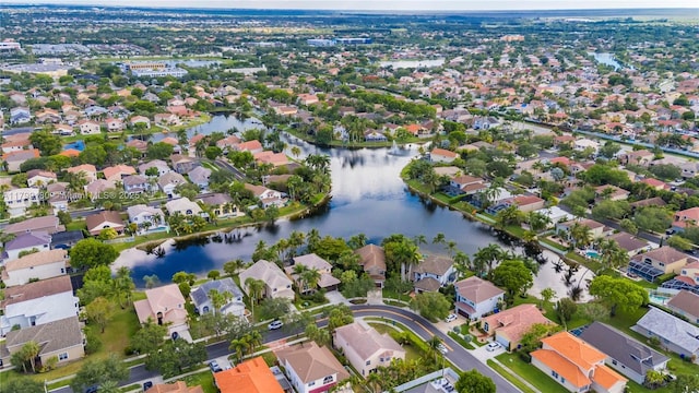 view of property location with nearby suburban area and a large body of water
