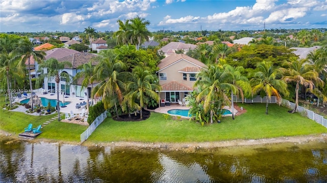 aerial view of residential area with a pool and a nearby body of water