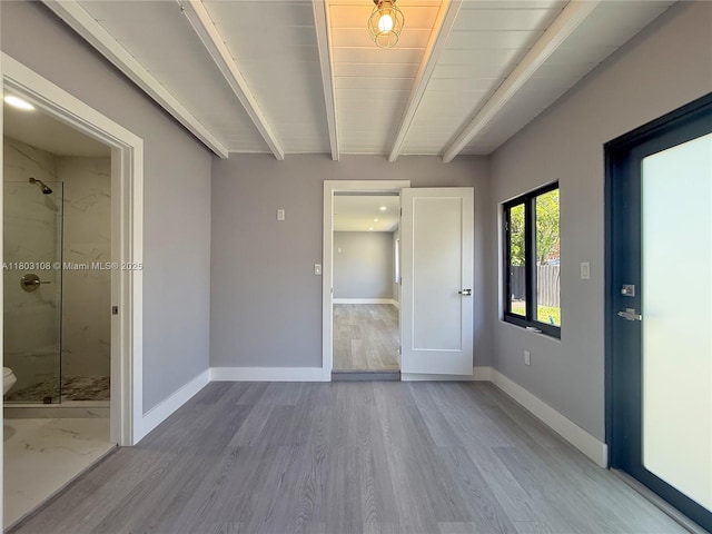 5741 SW 13th St, Miami, FL 33144 - unfurnished bedroom with baseboards, beam ceiling, and wood finished floors
