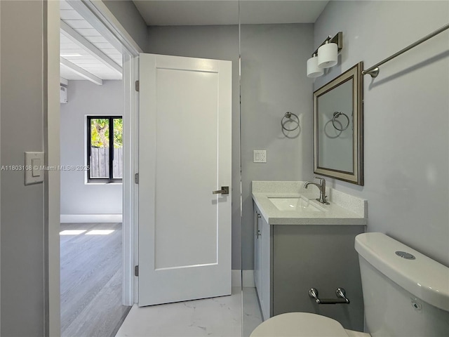 5741 SW 13th St, Miami, FL 33144 - bathroom with toilet, vanity, marble finish floors, and baseboards