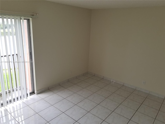 empty room with light tile patterned flooring