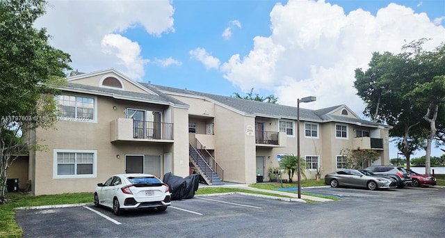 2151 NW 96th Ter Unit 15L, Pembroke Pines, FL 33024 - view of building exterior with uncovered parking