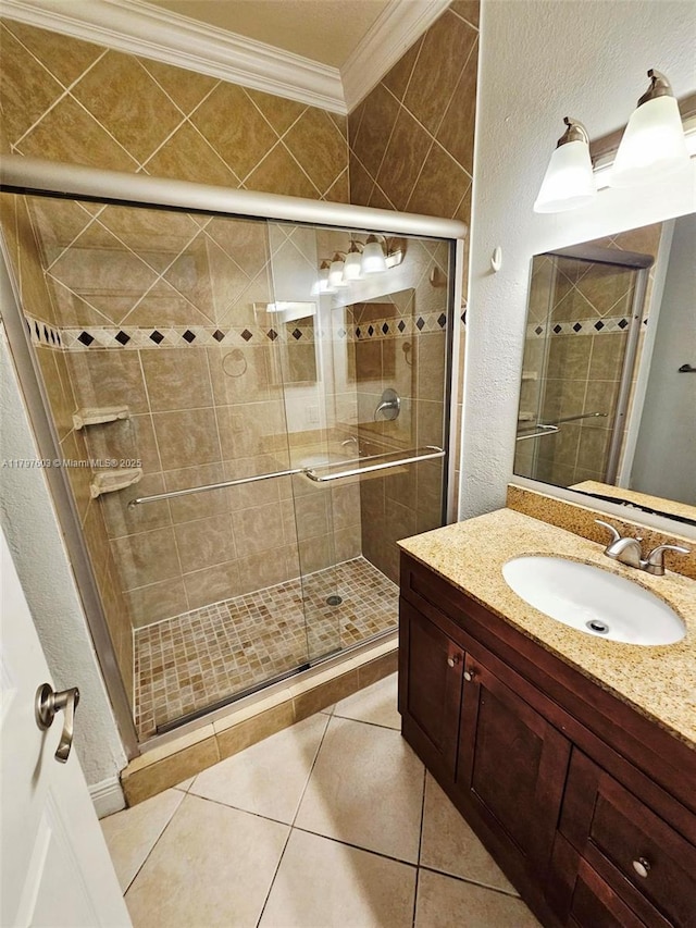 2151 NW 96th Ter Unit 15L, Pembroke Pines, FL 33024 - full bath featuring crown molding, vanity, a shower stall, tile patterned flooring, and a textured wall