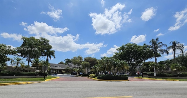 2151 NW 96th Ter Unit 15L, Pembroke Pines, FL 33024 - view of asphalt road with curbs and traffic signs