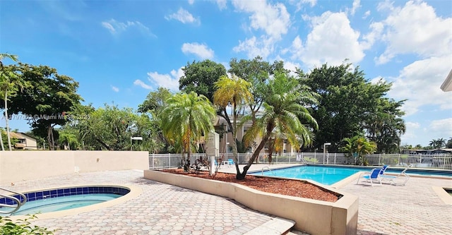 2151 NW 96th Ter Unit 15L, Pembroke Pines, FL 33024 - community pool with a community hot tub and a patio