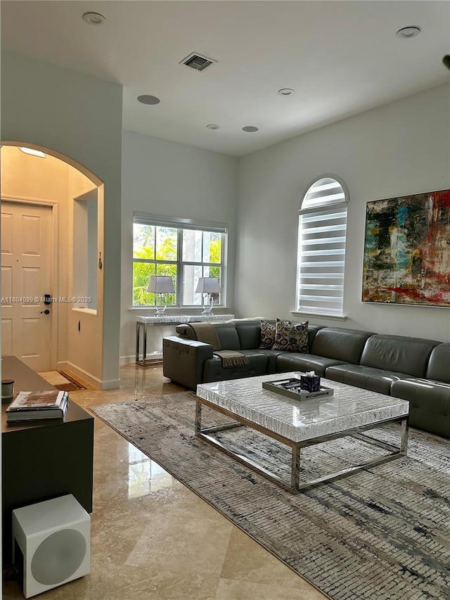 822 E Spinnaker Dr E, Hollywood, FL 33019 - living room featuring arched walkways and marble tiled flooring