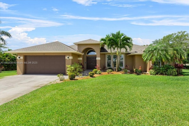 112 SW N Danville Cir, Port St Lucie, FL 34953 - view of front facade featuring an attached garage, concrete driveway, a front lawn, and stucco siding