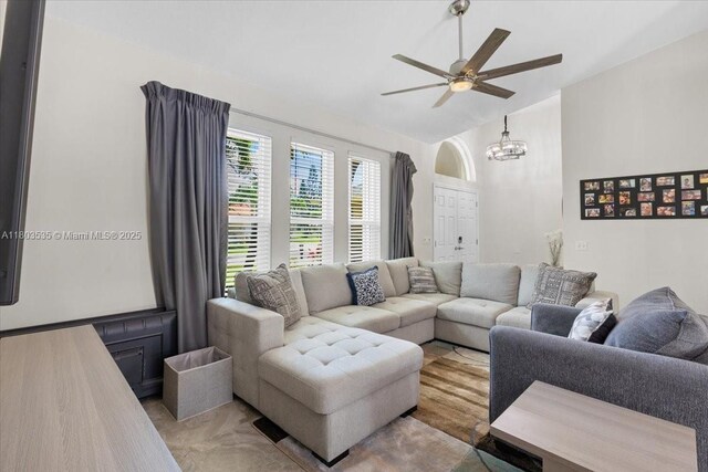112 SW N Danville Cir, Port St Lucie, FL 34953 - living area featuring vaulted ceiling, ceiling fan, and a chandelier
