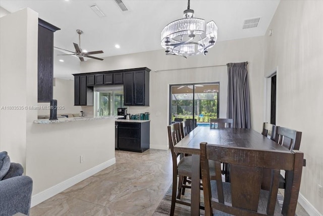 112 SW N Danville Cir, Port St Lucie, FL 34953 - dining area with a chandelier, baseboards, light marble finish floors, a ceiling fan, and recessed lighting