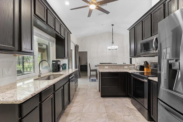 112 SW N Danville Cir, Port St Lucie, FL 34953 - kitchen featuring stainless steel appliances, a peninsula, a sink, a ceiling fan, and vaulted ceiling