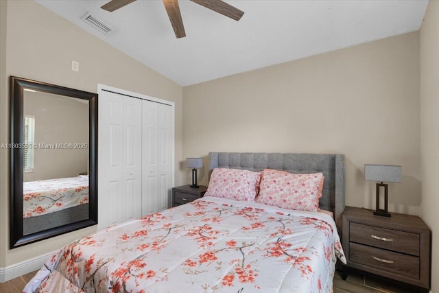 112 SW N Danville Cir, Port St Lucie, FL 34953 - bedroom with vaulted ceiling, a closet, wood finished floors, a ceiling fan, and baseboards