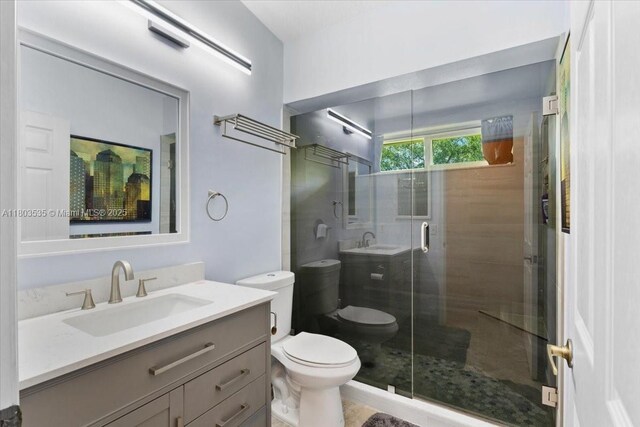 112 SW N Danville Cir, Port St Lucie, FL 34953 - bathroom with toilet, a shower stall, and vanity