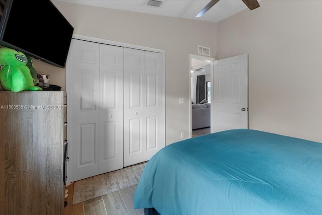 112 SW N Danville Cir, Port St Lucie, FL 34953 - bedroom with lofted ceiling, wood finished floors, a closet, and ceiling fan