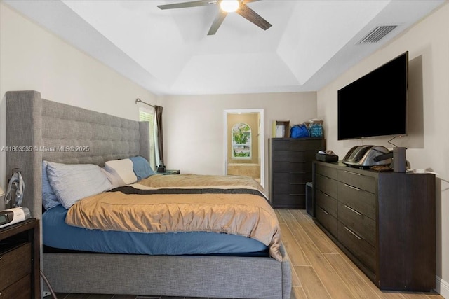 112 SW N Danville Cir, Port St Lucie, FL 34953 - bedroom featuring a raised ceiling, wood finish floors, and ceiling fan