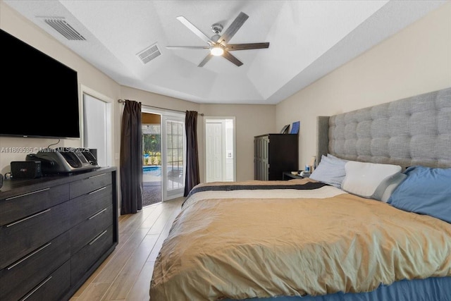 112 SW N Danville Cir, Port St Lucie, FL 34953 - bedroom with access to exterior, light wood finished floors, lofted ceiling, and a ceiling fan