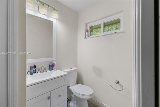 112 SW N Danville Cir, Port St Lucie, FL 34953 - half bathroom featuring toilet, vanity, and baseboards
