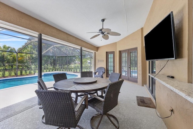 112 SW N Danville Cir, Port St Lucie, FL 34953 - sunroom with french doors, ceiling fan, a pool, lofted ceiling, and outdoor dining space
