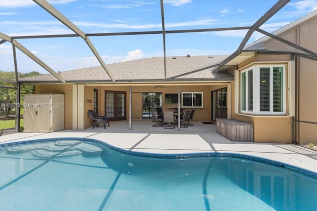 112 SW N Danville Cir, Port St Lucie, FL 34953 - outdoor pool featuring french doors, a patio, and glass enclosure