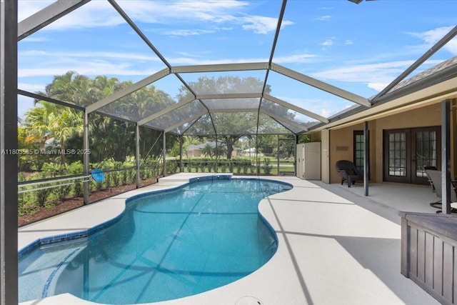 112 SW N Danville Cir, Port St Lucie, FL 34953 - outdoor pool featuring french doors, a patio, and a lanai