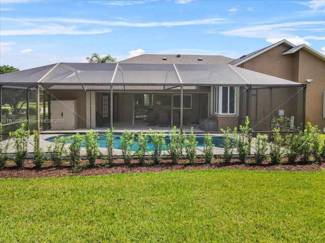 112 SW N Danville Cir, Port St Lucie, FL 34953 - back of house with a lanai, stucco siding, a patio, and a yard