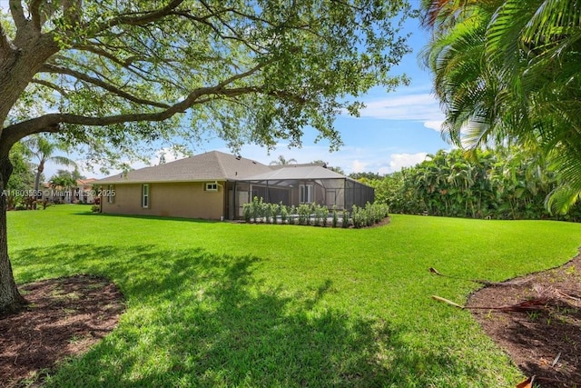 112 SW N Danville Cir, Port St Lucie, FL 34953 - view of green lawn with a lanai
