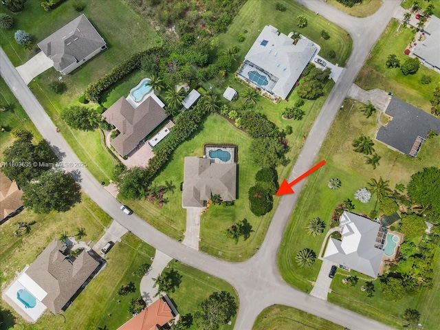 112 SW N Danville Cir, Port St Lucie, FL 34953 - aerial view of property's location with a pool area and nearby suburban area