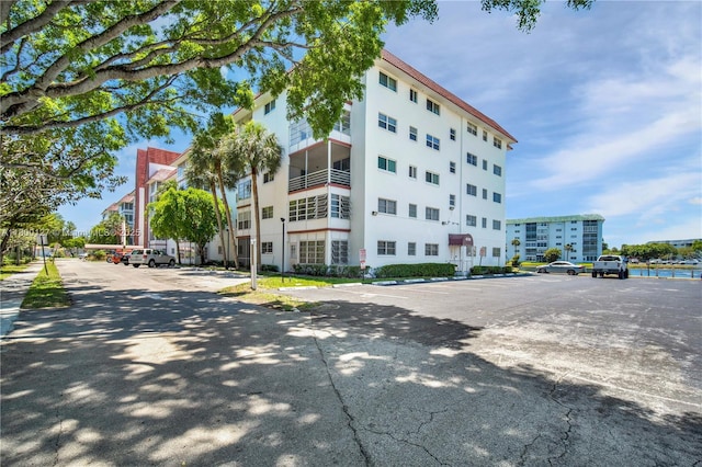 view of property with uncovered parking