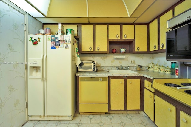 kitchen featuring white fridge with ice dispenser, dishwashing machine, a sink, black microwave, and light countertops