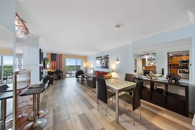 400 Kings Point Dr Unit 1021, Sunny Isles Beach, FL 33160 - dining area featuring wood finished floors