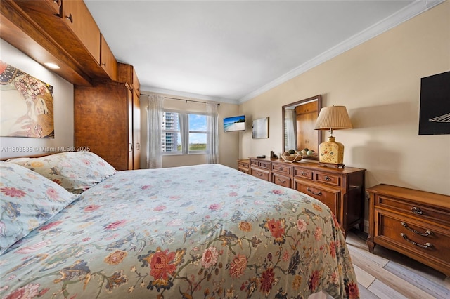 400 Kings Point Dr Unit 1021, Sunny Isles Beach, FL 33160 - bedroom featuring ornamental molding and light wood finished floors