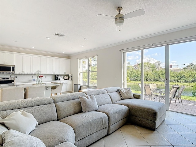 16435 SW 27th St, Miramar, FL 33027 - living area featuring ornamental molding, a ceiling fan, light tile patterned floors, recessed lighting, and a textured ceiling