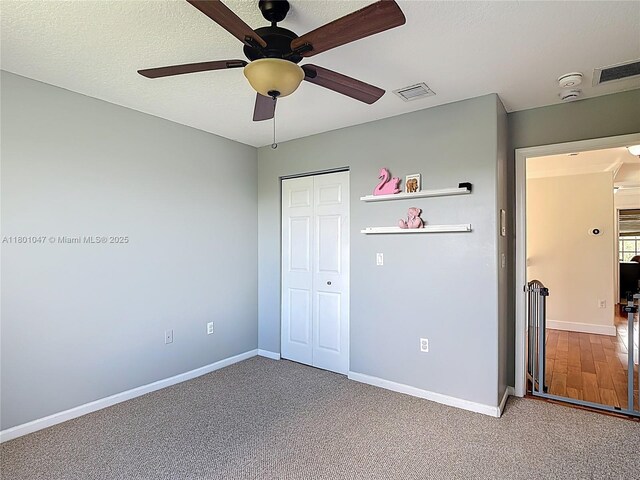 16435 SW 27th St, Miramar, FL 33027 - unfurnished bedroom featuring baseboards, carpet flooring, a closet, ceiling fan, and a textured ceiling