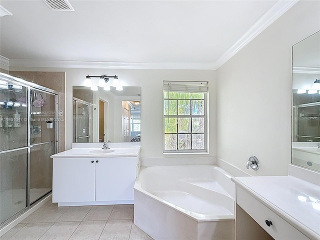 16435 SW 27th St, Miramar, FL 33027 - full bathroom featuring a shower stall, tile patterned floors, a garden tub, ornamental molding, and two vanities