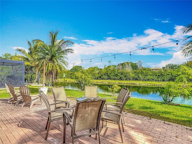 16435 SW 27th St, Miramar, FL 33027 - wooden terrace featuring a water view, a patio, and outdoor dining space