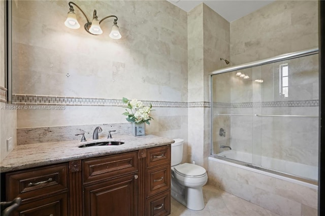 20508 SW 140th Ave, Miami, FL 33177 - bathroom with tile walls, toilet, tiled shower / bath, tile patterned flooring, and vanity
