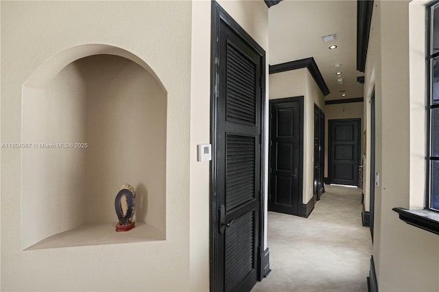 20508 SW 140th Ave, Miami, FL 33177 - hall featuring recessed lighting, light tile patterned flooring, crown molding, and arched walkways