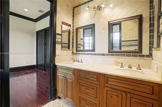 20508 SW 140th Ave, Miami, FL 33177 - bathroom with ornamental molding, wood finished floors, double vanity, and baseboards
