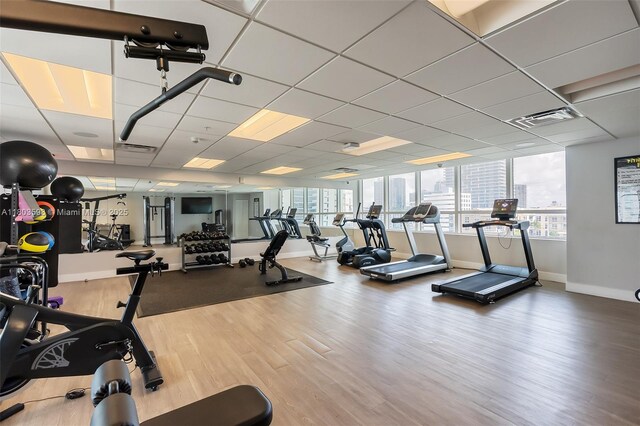 321 NE 26th St Unit 614, Miami, FL 33137 - exercise room with baseboards and wood finished floors